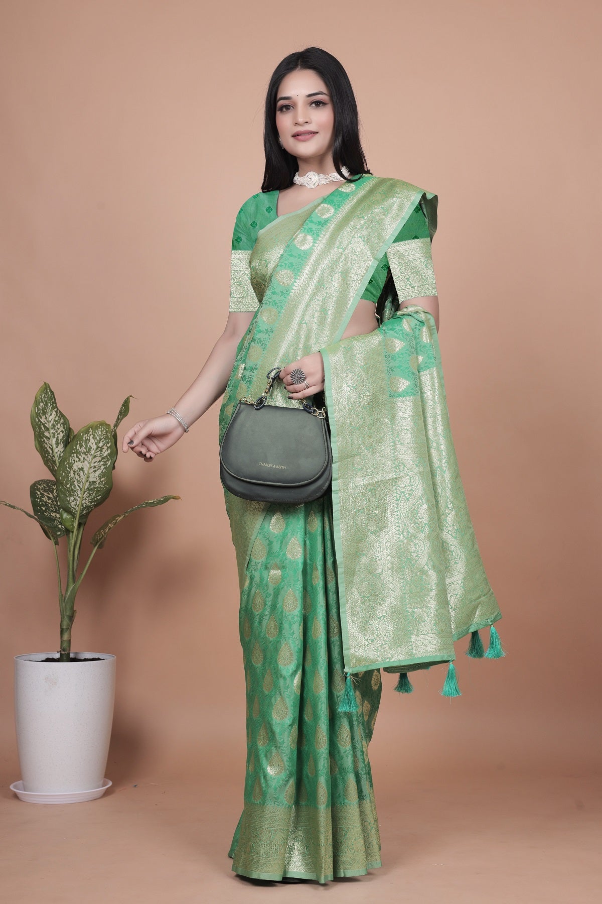 Elegant Green Banarasi Silk Saree with Golden Zari Work & Tassel Border