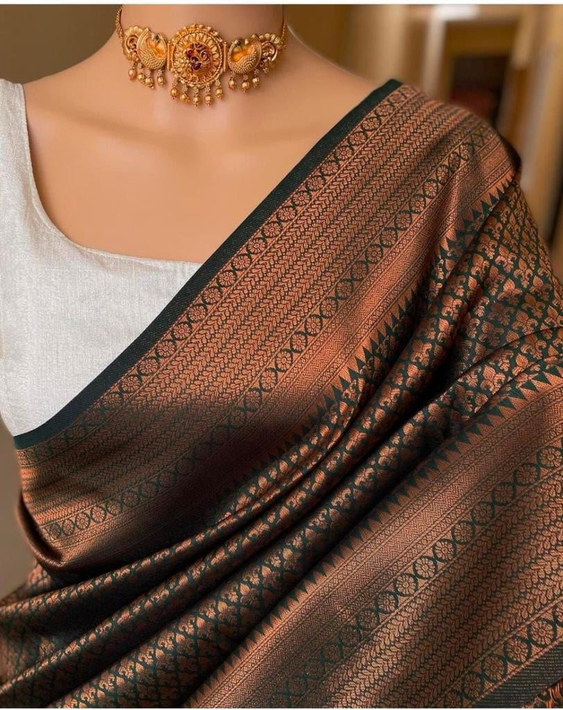 Sumptuous Green Soft Silk Saree With Demure Blouse Piece