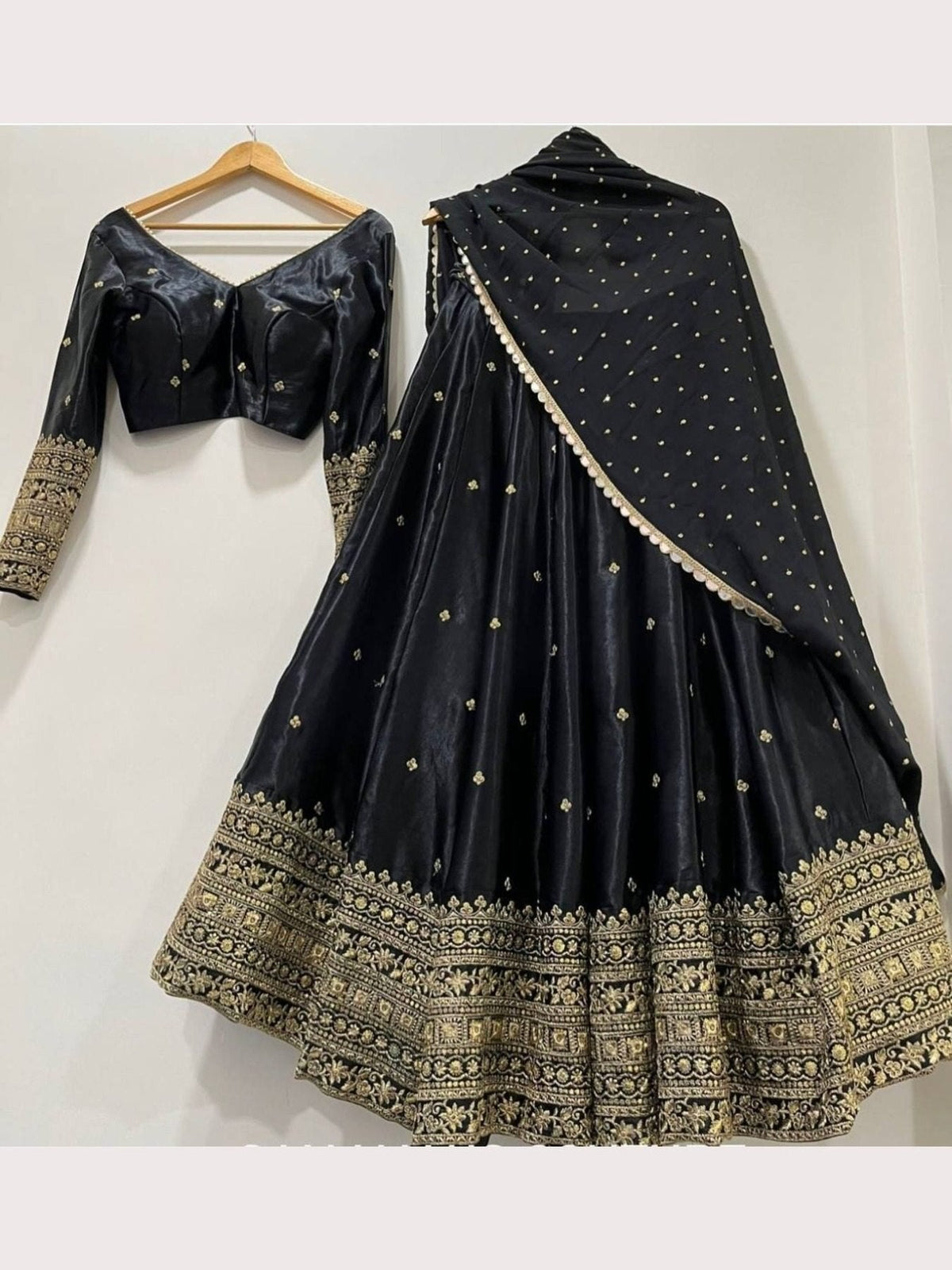 Elegant Black Silk Lehenga Choli with Heavy Gold Embroidered Border & Dupatta