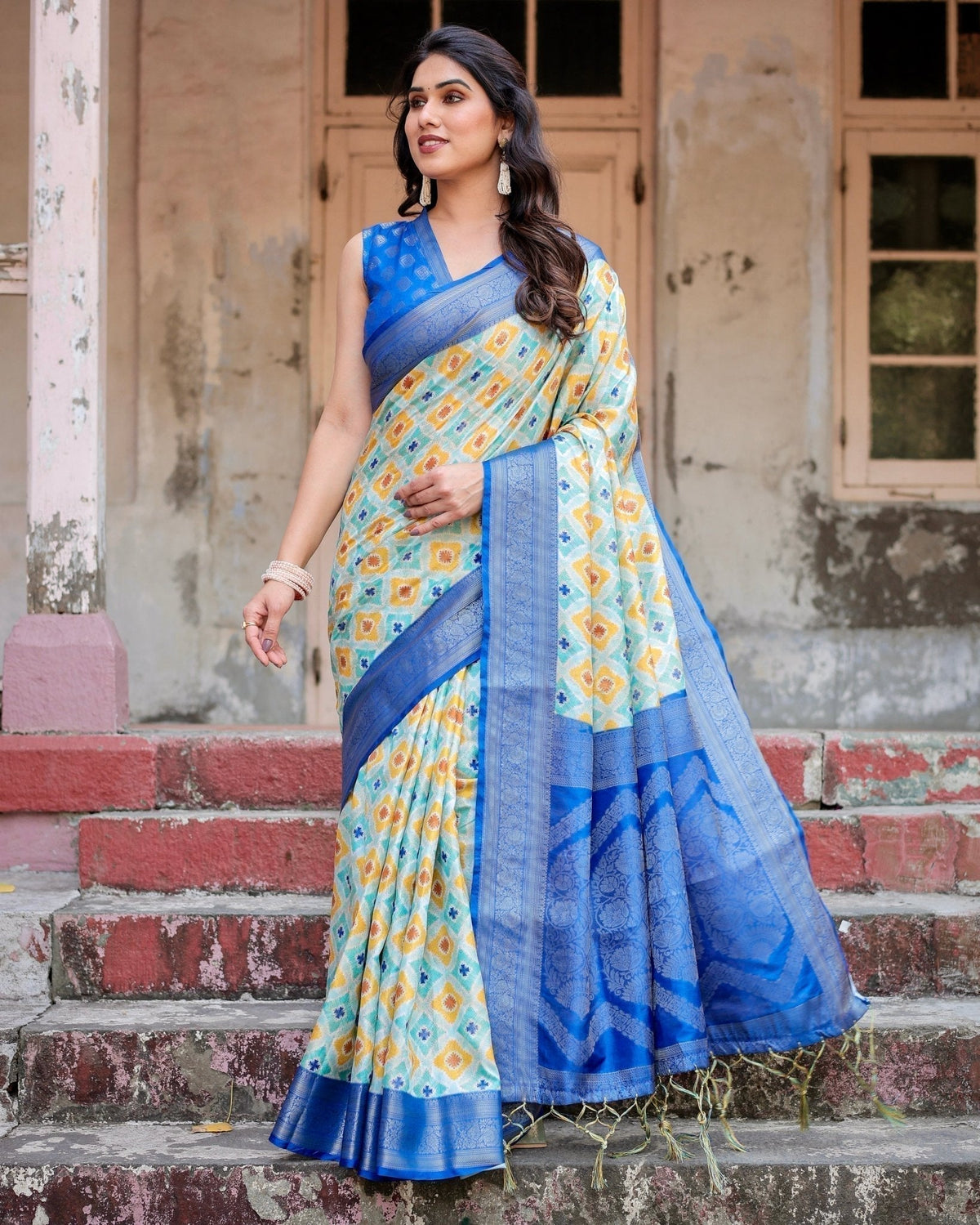 Yellow and Blue Ikat Digital Print Banarasi Silk Saree with Zari Weave and Tassel-Embellished Pallu
