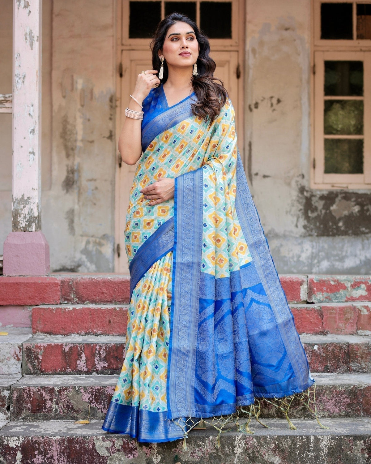 Yellow and Blue Ikat Digital Print Banarasi Silk Saree with Zari Weave and Tassel-Embellished Pallu