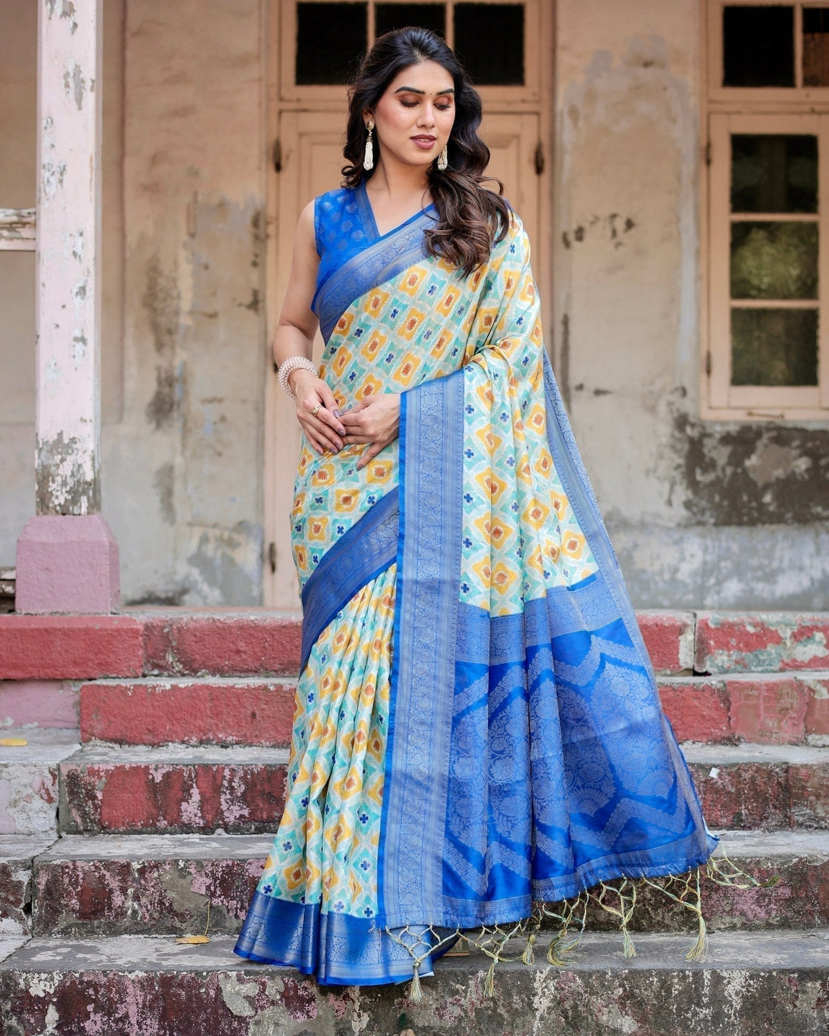 Yellow and Blue Ikat Digital Print Banarasi Silk Saree with Zari Weave and Tassel-Embellished Pallu
