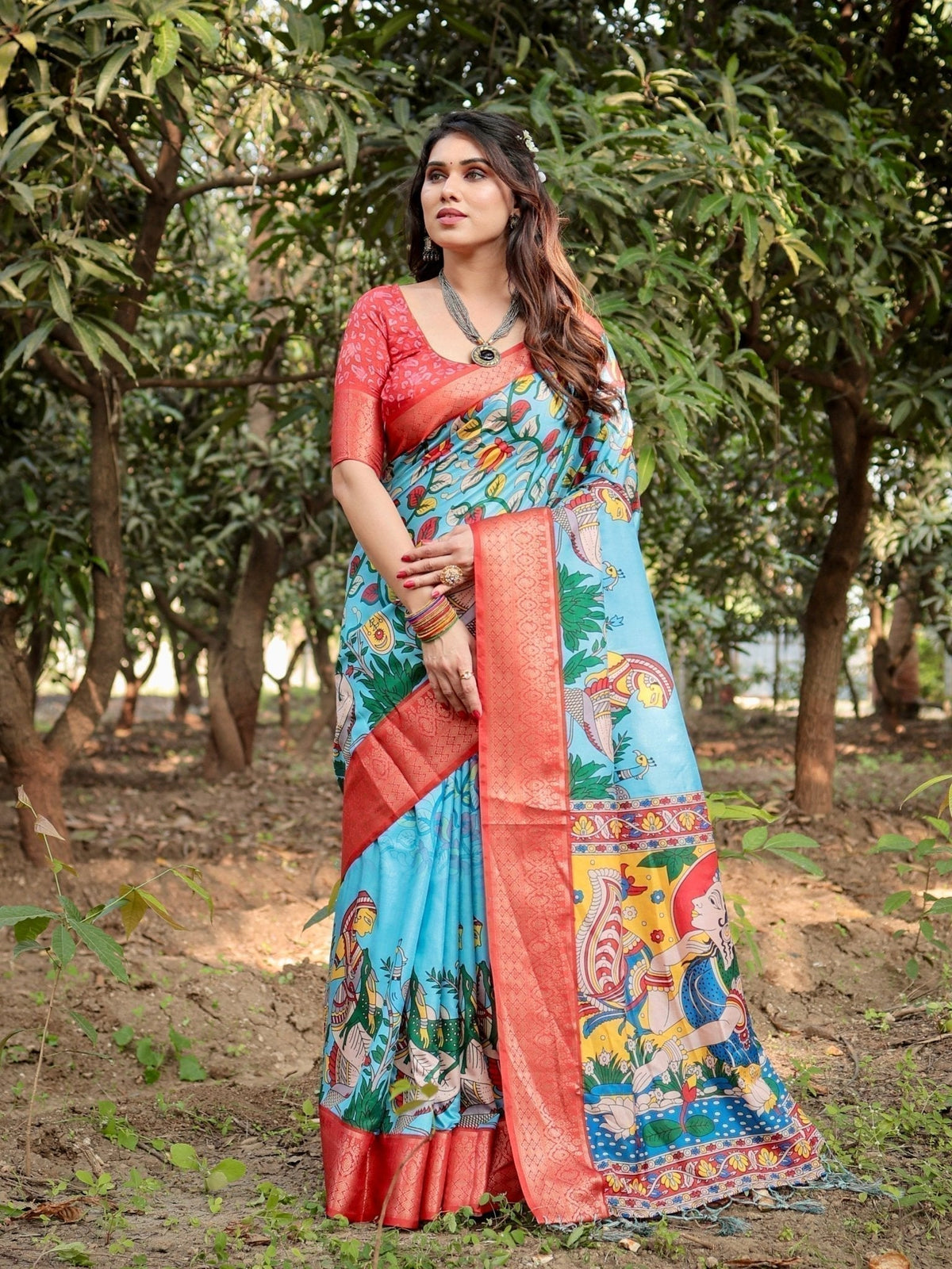 Aqua Blue Tussar Silk Saree with Vibrant Nature-Inspired Prints and Red Zari Border