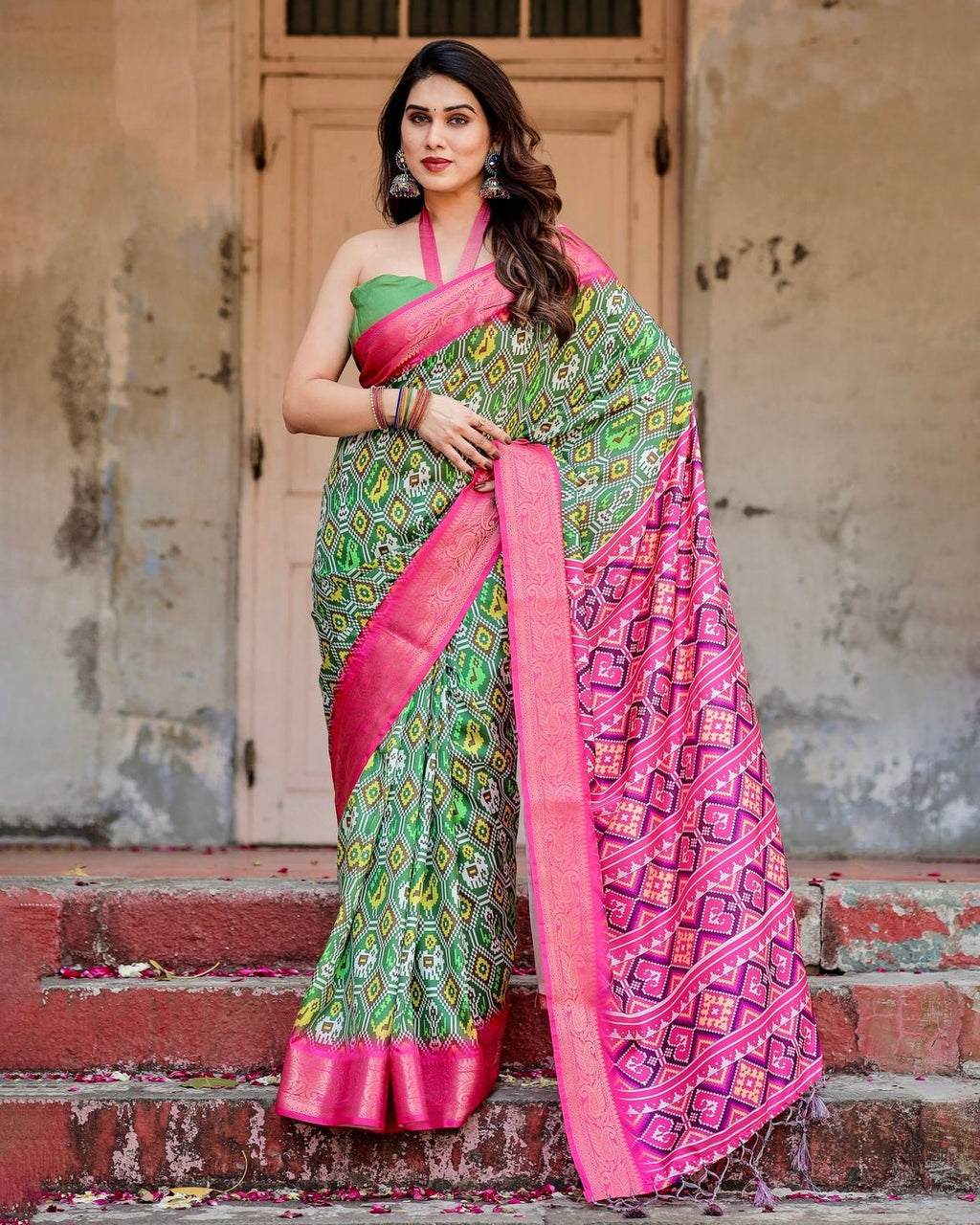 Green and Pink Tussar Silk Saree with Vibrant Ikat Patterns and Zari Border